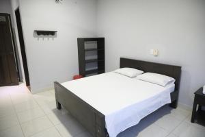 Postel nebo postele na pokoji v ubytování Hospedaje Aquel Almendro