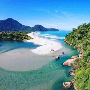 an aerial view of a beach in the ocean at Pousada Morena Raiz in Ubatuba