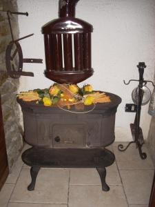 a stove with food inside of it at Maison Mariot in Roure Turin