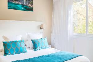 Postel nebo postele na pokoji v ubytování Best Western Plus Hôtel la Rade