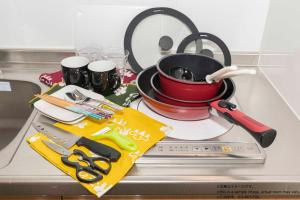 a kitchen counter with a pot on a stove at Stay SAKURA Kyoto Station South I in Kyoto