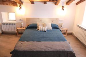 Katil atau katil-katil dalam bilik di Casa Rural Marem