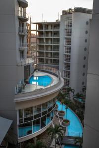 an overhead view of a building with a swimming pool at Stay at The Point - Seaside Saunter in Durban