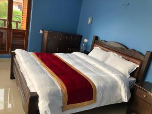A bed or beds in a room at The Hotel
