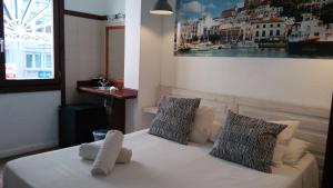 Cama o camas de una habitación en Hostal Ibiza