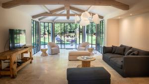 a living room with a couch and a table at Domaine du Buc, Le Château in Marssac-sur-Tarn