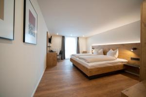 
Ein Bett oder Betten in einem Zimmer der Unterkunft Pflugwirts Hotel und Gasthaus

