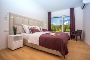 Posteľ alebo postele v izbe v ubytovaní Villa Agava with heated pool, Jacuzzi, sauna, gym, 4 en-suite bedrooms