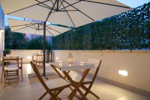 En terrasse eller udendørsområde på Porta San Biagio Rooms