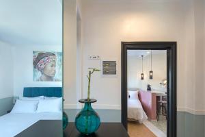 Posteľ alebo postele v izbe v ubytovaní Athenian Lofts