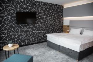 Postel nebo postele na pokoji v ubytování Hotel Limanova