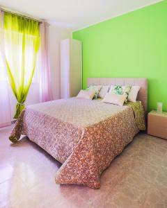 מיטה או מיטות בחדר ב-Rivela case vacanze
