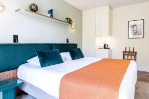 מיטה או מיטות בחדר ב-Hotel Le Friedland
