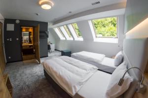 Postel nebo postele na pokoji v ubytování Hotel Limanova