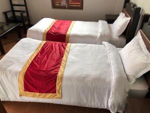 A bed or beds in a room at The Hotel