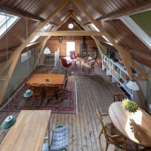 an overhead view of a living room and dining room at bnb De Loft in Kloosterzande