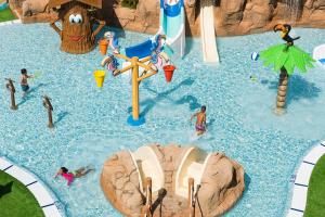 a group of people playing in a water park at Apartaments Els Llorers in Lloret de Mar