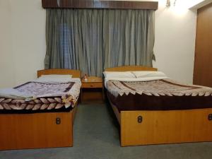 Voodi või voodid majutusasutuse Hotel Down Town toas