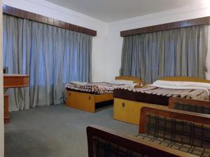 Voodi või voodid majutusasutuse Hotel Down Town toas