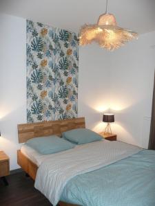 Ein Bett oder Betten in einem Zimmer der Unterkunft La Porte du Paradis