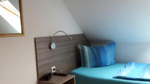 Postel nebo postele na pokoji v ubytování Pension Zentrum Riesa