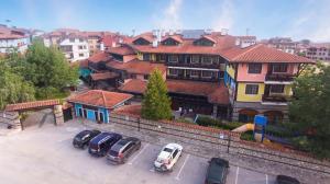 a group of cars parked in a parking lot at Hotel Tanne in Bansko