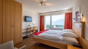 Voodi või voodid majutusasutuse Hôtel Splendide toas