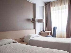 Postel nebo postele na pokoji v ubytování Hotel Brial