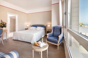 Postel nebo postele na pokoji v ubytování Hotel Sina Astor