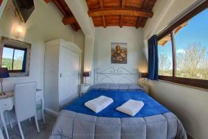 Postel nebo postele na pokoji v ubytování Agriturismo Baldassari