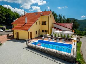 a house with a swimming pool in front of it at Apartment Oltari-3 by Interhome in Biljevine