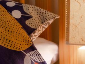 a close up of a tie next to a lamp at Holiday Home Mountain View Farm by Interhome in Llanfachreth