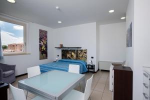 Posteľ alebo postele v izbe v ubytovaní Porta Pispini Residence