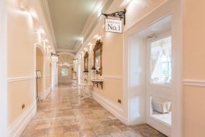 a hallway of a store with a sign on the wall at Grange Hotel in Grange Over Sands