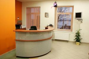 a lobby with a reception desk in a hospital at Pas Stefą in Telšiai