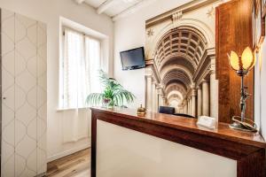 a room with a reception desk in a building at Magenta Deluxe Cancello in Rome