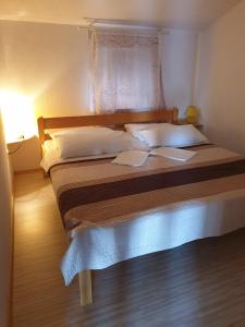 Postel nebo postele na pokoji v ubytování Marijan