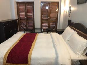 A bed or beds in a room at The Hotel