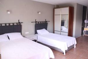 Ein Bett oder Betten in einem Zimmer der Unterkunft Nemrut Kervansaray Hotel