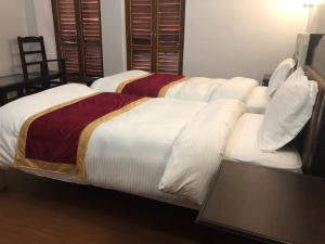 A bed or beds in a room at The Hotel