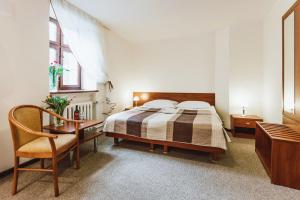 Postel nebo postele na pokoji v ubytování Hotel Gromada Toruń
