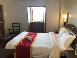 A bed or beds in a room at The Hotel