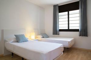 Кровать или кровати в номере Pierre & Vacances Empuriabrava Marina