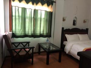 A bed or beds in a room at The Hotel