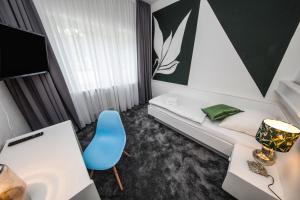 Postel nebo postele na pokoji v ubytování Kleines Hotel Heimfeld