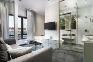 Televízia a/alebo spoločenská miestnosť v ubytovaní RentPlanet - Studio Ruska