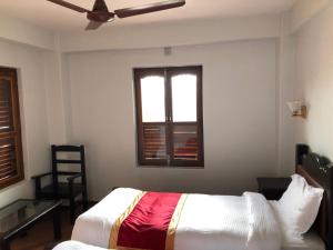 A bed or beds in a room at The Hotel