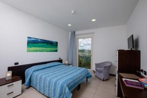 Posteľ alebo postele v izbe v ubytovaní Porta Pispini Residence