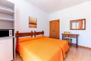 Ein Bett oder Betten in einem Zimmer der Unterkunft Hostal Residencia San Francisco