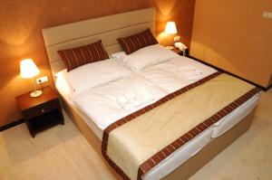 Postel nebo postele na pokoji v ubytování Hotel Predium